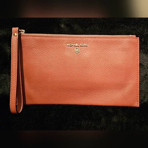Michael Kors Handbags - Michael Kors' large wristlet "rust like color"